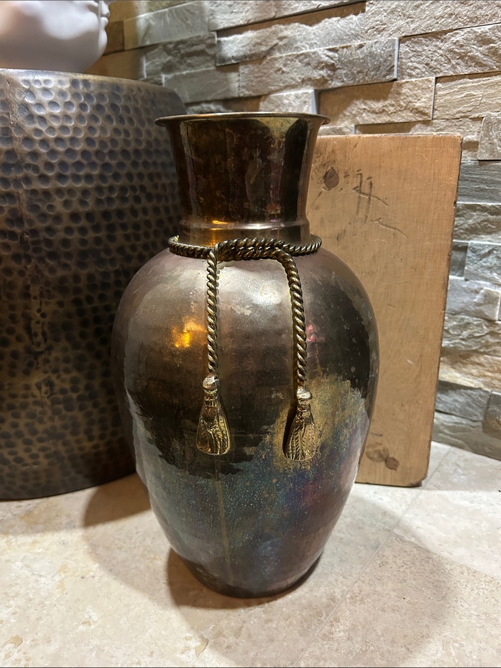 vintage hammered brass vase featuring a decorative braided rope detail